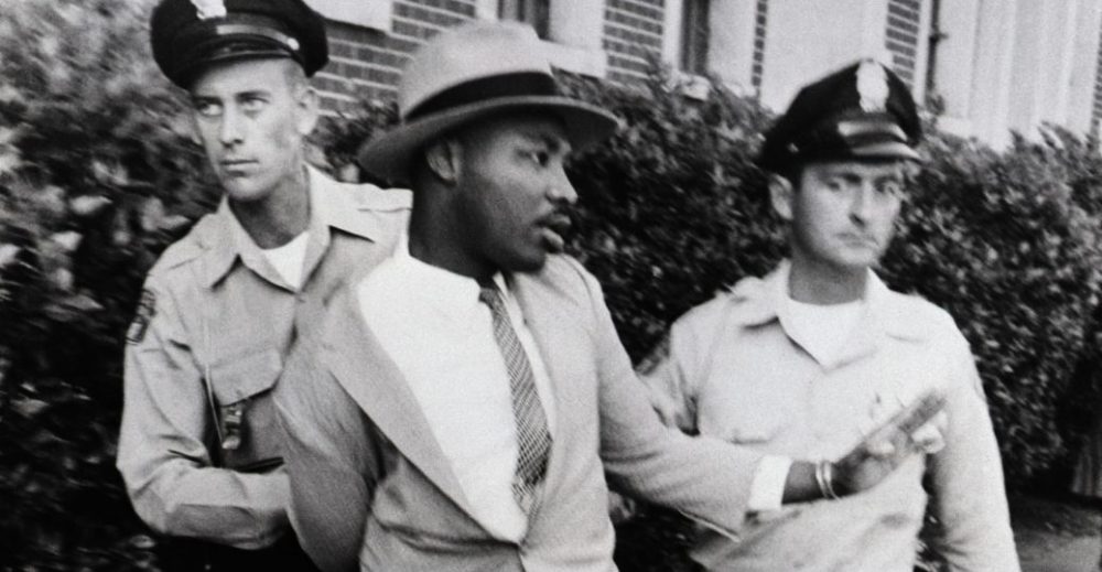 Martin Luther King Jr is arrested by two white police officers in Montgomery Alabama on September 4, 1958 | Source: History.com