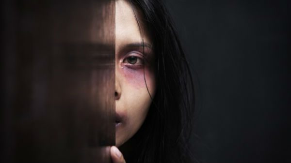 abusedwomanhiding-shutterstock-615x345