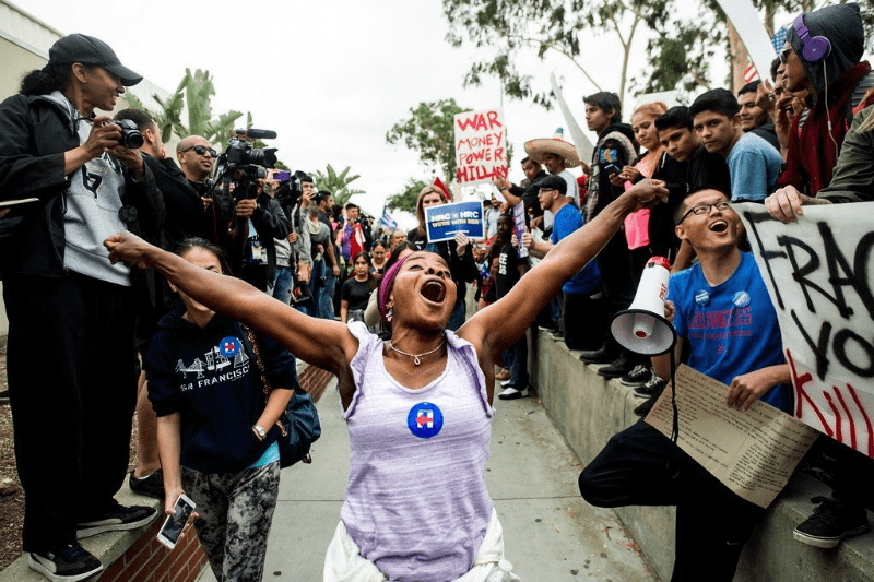 hillary-supporter-arms-raised-1024x682